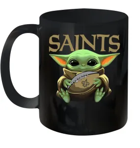 Baby Yoda Loves The New Orleans Saints Star Wars Baby Yoda Hugs Saints NFL Ceramic Mug 11oz