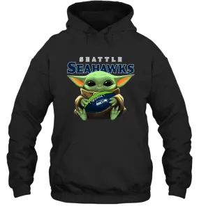 Baby Yoda Loves The Seattle Seahawks Star Wars Baby Yoda Hugs Seahawks NFL Adult Hoodie Sweatshirt