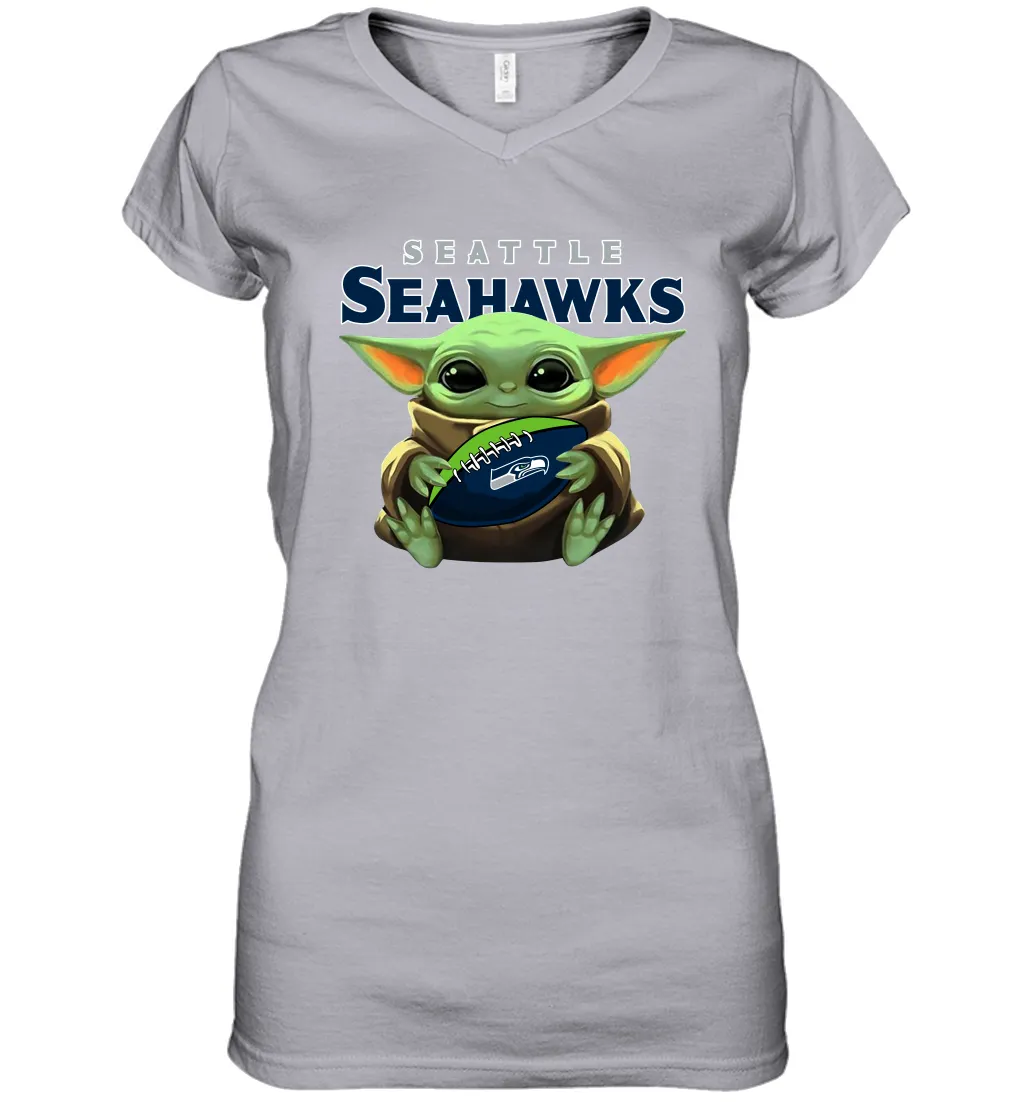 Baby Yoda Loves The Seattle Seahawks Star Wars Baby Yoda Hugs Seahawks NFL Womens V-Neck T-Shirt